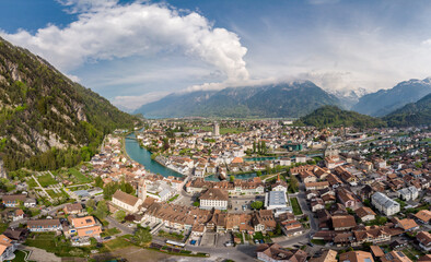 Fototapeta na wymiar Aerial panorama of the famous Interlaken old town at the foot of the Jungfrau region in the alps in Canton Bern in Switzerland