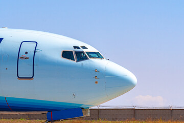 Cockpit of big passenger airliner on runway close up