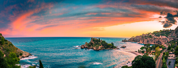 Colorful sunset sky at Isola Bella Nature Reserve in Taormina, Sicily 