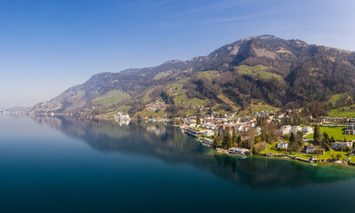 Fototapeta na wymiar Stunning view of the coast of lake Lucerne and Vitznau village in Canton Lucerne in Switzerland
