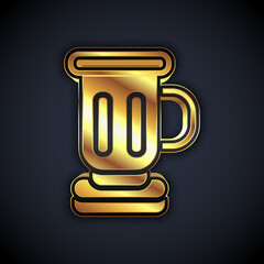 Gold Medieval goblet icon isolated on black background. Vector