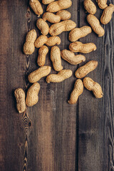 beer mug peanuts in shells on wooden background snack bar
