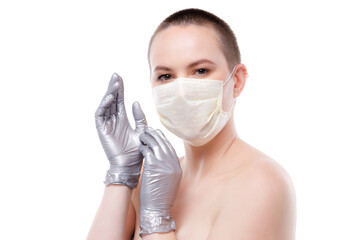 Beauty portrait of a short-haired woman in mask and gloves