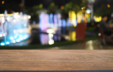 Empty wooden table in front of abstract blurred background of coffee shop . can be used for display or montage your products.Mock up for display of product