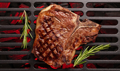 T-bone beef steak cooking on grill