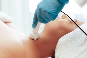 Beautiful woman getting facial skincare treatment in a cosmetic beauty clinic