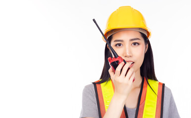 Engineer woman wear reflective vest and using walkie talkie for talking with her team. Worker Young asian engineer woman is telling staff by using walkie talkie. isolated white background, copy space