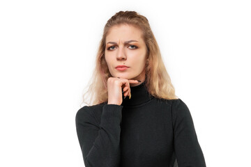 Close up blonde girl is looking serious and thoughtful, with one arm crossed and hand on chin,...