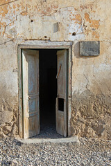 Fototapeta na wymiar Old wooden doorway in abandoned egyptian house