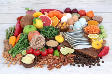 Worlds healthiest food selection  high in protein, omega 3, vitamins, minerals, antioxidants, anthocyanins and fibre. Large collection of immune boosting health foods concept on rustic wood. Top view.
