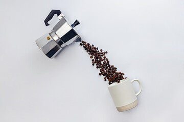 Coffee beans pouring from moka pot.