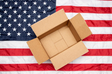 USA flag and shipping box. Delivery from the USA