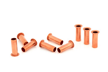 Copper inserts 10 mm used in plumbing to stop pipe collapsing when used with compression fittings. In a group on white background.