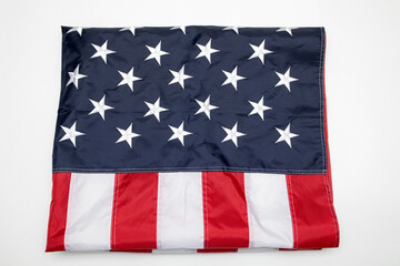 USA flag folded on white background. American flag folded on white background. Memorial day concept.