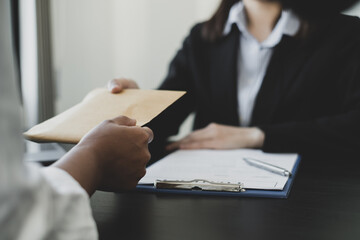 Businessmen make an agreement with the money proposed his partner to bribe in the company. The concept of bribery and corruption