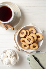 cup of coffee with cookies