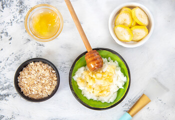 Ingredients for homemade scrub banana, honey, oatmeal coconut oil. Beauty Concept