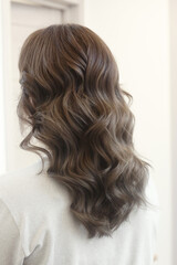 light brown long curly loose hair closeup photo in hair salon back view