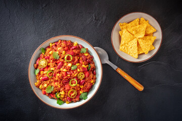 Chilli con carne with nachos, shot from above