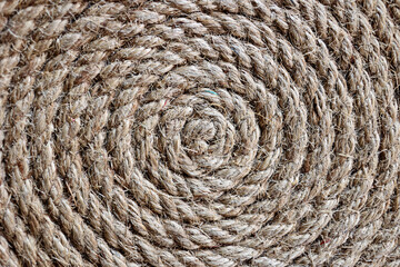 Rope made of plants rolled into a circle. Top view of Hemp rope background.
