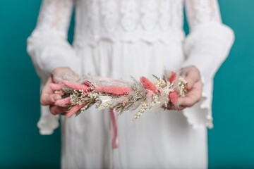 Bright trendy composition of dried flowers, home decor, a long-lasting gift of flowers and herbs