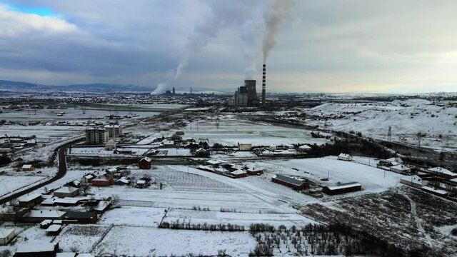 Drone flying towards the industrial part of the settlement