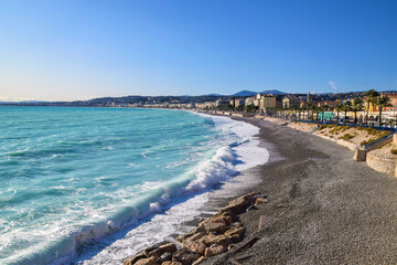 An empty beach in Nice, South of France during winter, closed to the public due to strong waves.