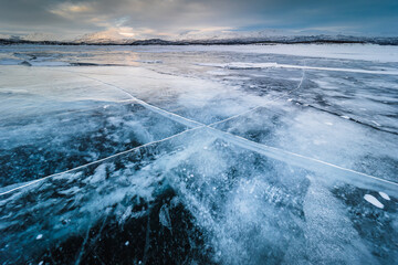 The frozen lake Torneträsk in Swedish Lapland. Beautiful ice forms create an amazing sight.
