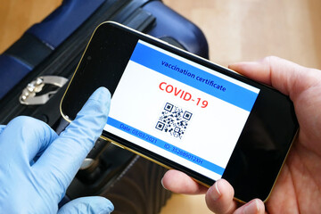 Vaccination passport on a mobile phone allowing travel in hand. Vaccination against the coronavirus Covid 19.Imunity or Health passport