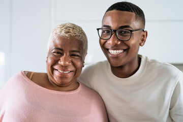 Happy smiling Hispanic mother and son portrait - Family love and unity concept