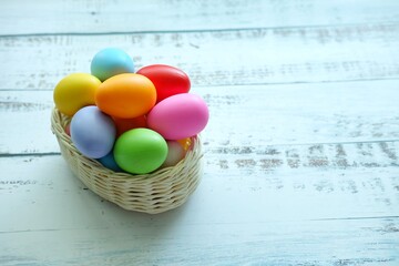 Close up of Colorful Easter Eggs on white wooden background.