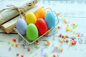 Close up of Colorful Easter Eggs on white wooden background.