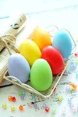 Close up of Colorful Easter Eggs on white wooden background.