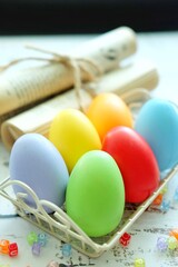 Close up of Colorful Easter Eggs on white wooden background.