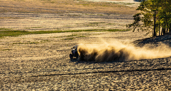 Panoramic view of Bledowska Desert with sand buggy off-road vehicles extreme riding at Dabrowka view point near Chechlo in Lesser Poland