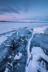 The frozen lake Torneträsk in Swedish Lapland. Beautiful ice forms create an amazing sight.
