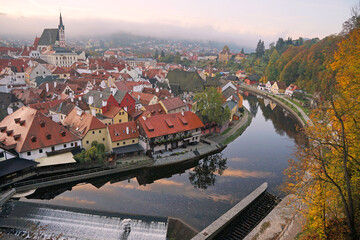 Obraz premium Cesky Krumlov historic medieval town aerial panoramic cityscape sunrise, famous tourist destination, guided tour concept, Czech Republic