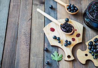 Black currant jam with black currants fresh berries