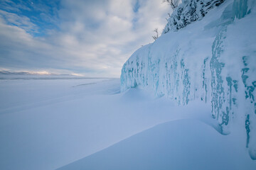 The frozen lake Torneträsk in Swedish Lapland. Beautiful ice forms create an amazing sight.