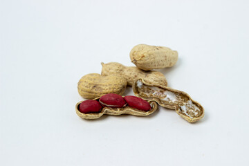Isolated peanuts on a white background. Peanuts in shells. Beer snack.