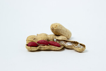 Isolated peanuts on a white background. Peanuts in shells. Beer snack.