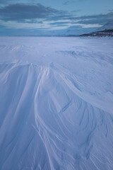 The frozen lake Torneträsk in Swedish Lapland. Beautiful ice forms create an amazing sight.