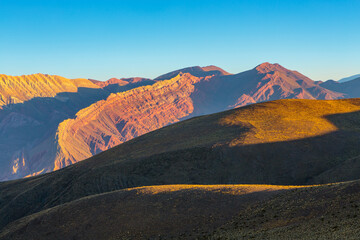 Serrania de Hornocal. The colourful mountain range of Hornocal in the Andes foothills in warm afternoon light