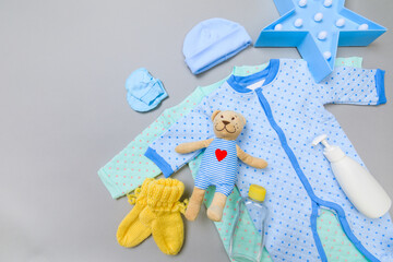 Baby concept. Baby cloth and goods on grey  background. Place for text. View from above. Flat Lay - Image