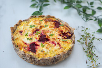 Fresh homemade tart with feta cheese and beetroot