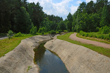 An empty artificial canal without water for sports.