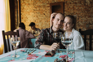Portrait of a beautiful young couple in love at a restaurant.