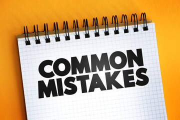 Common Mistakes text quote on notepad, concept background