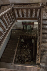 Stairs with rubble in an abandoned building