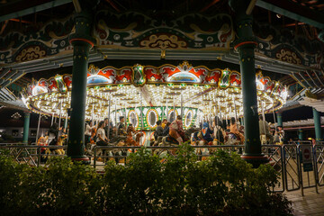 Fototapeta na wymiar Night Merry go round Carousel ride at Dufan Amusement Park.